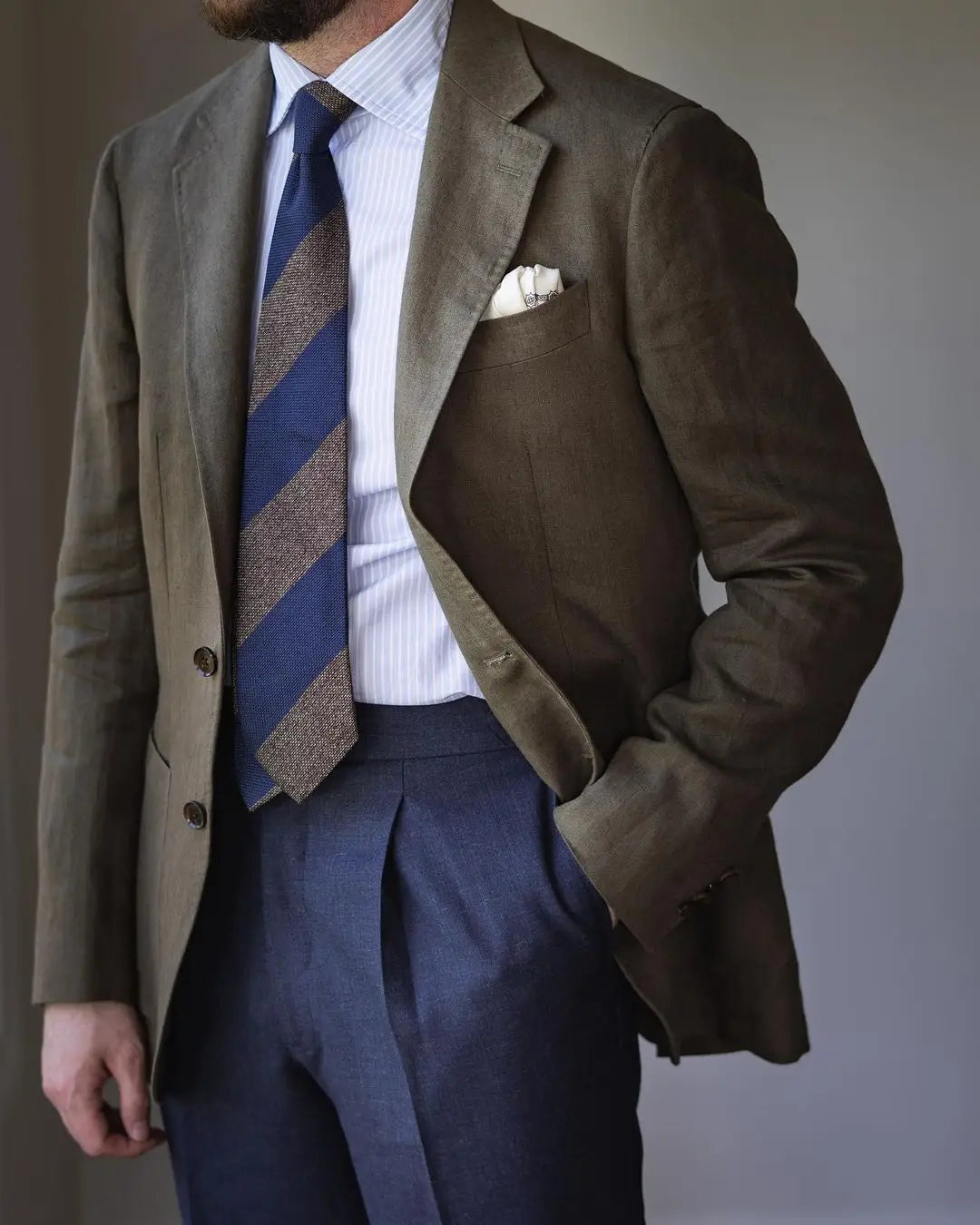 Olive green blazer with striped tie showcasing accountant outfits for client meetings Australian Style Institute