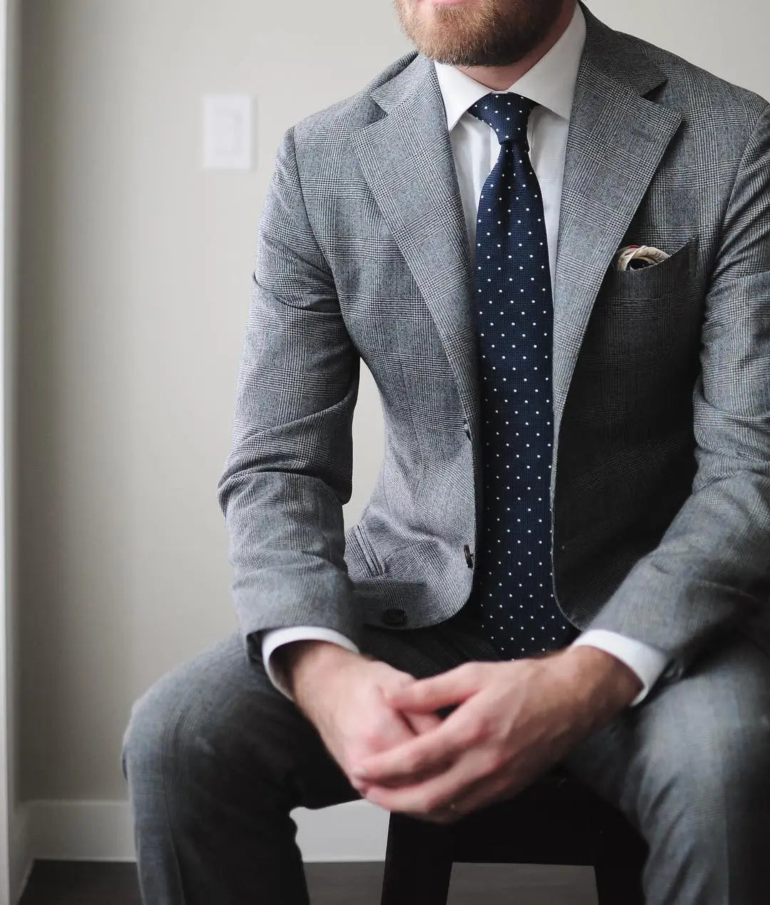 Gray suit with navy polka dot tie for professional accountant outfits ideal for client meetings Australian Style Institute