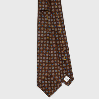 Back view of brown foulard printed silk tie with handmade detailing.