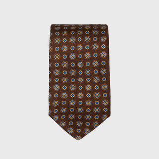 Brown foulard printed silk tie with medallion pattern, handmade in Italy.