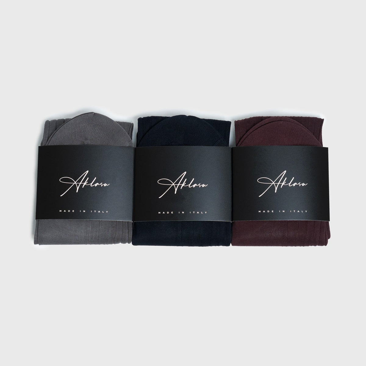 3-Sock Bundle featuring gray, navy, and burgundy dress socks with premium packaging, ideal for stylish everyday wear or gifting.