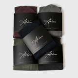 5-Sock Bundle featuring assorted colors including black, grey, green, burgundy, and navy, neatly packaged with branded labels. Ideal for stylish everyday wear.