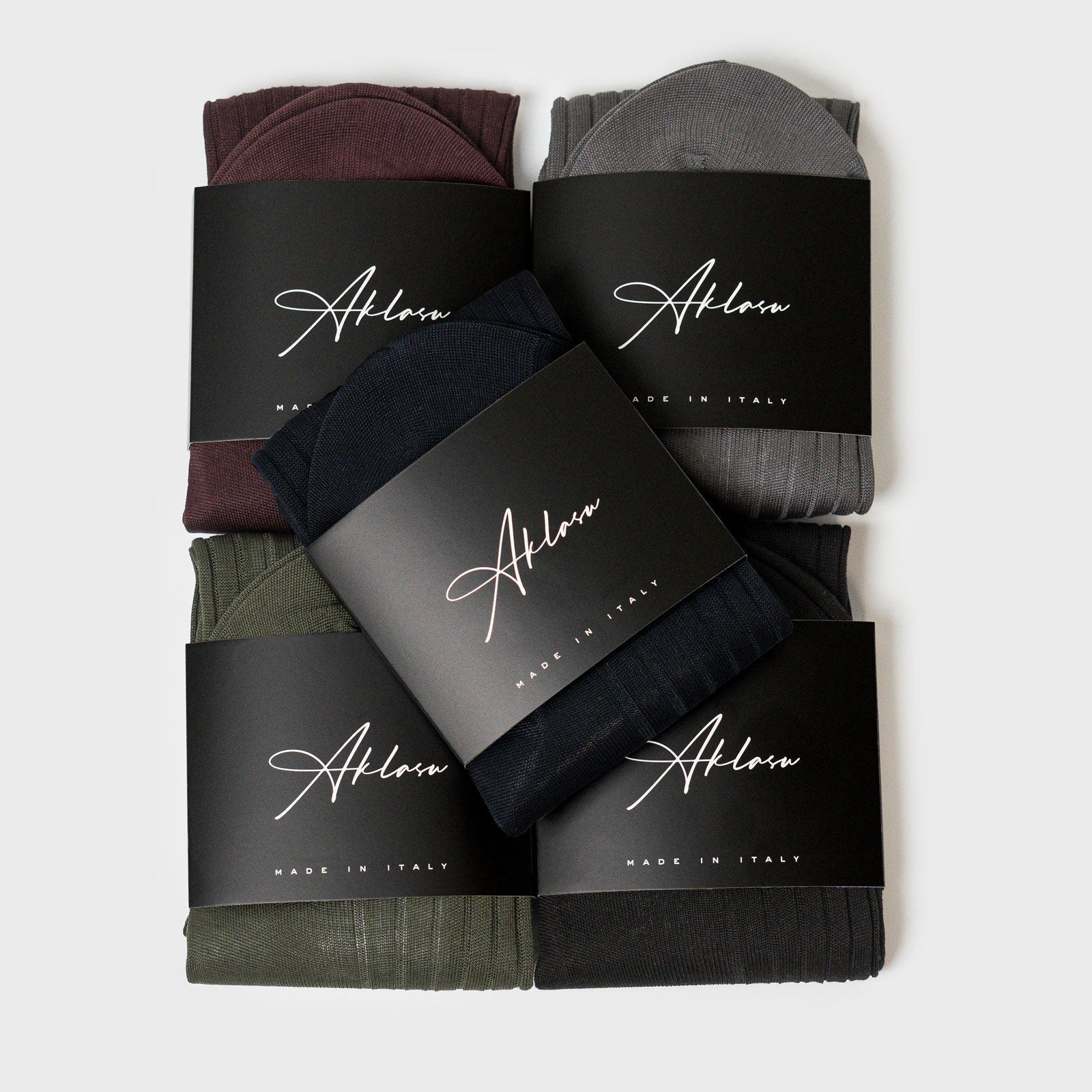 5-Sock Bundle featuring assorted colors including black, grey, green, burgundy, and navy, neatly packaged with branded labels. Ideal for stylish everyday wear.