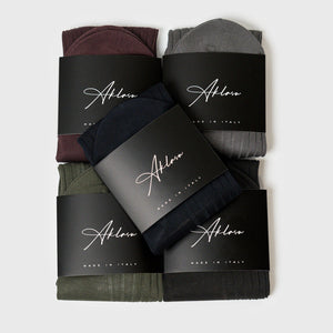 5-Sock Bundle featuring assorted colors including black, grey, green, burgundy, and navy, neatly packaged with branded labels. Ideal for stylish everyday wear.