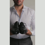 Getting dressed in a charcoal suit with the red floral grenadine tie