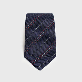 Red and white striped blue grenadine tie displayed flat.